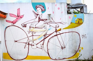 骑单车手绘墙效果图